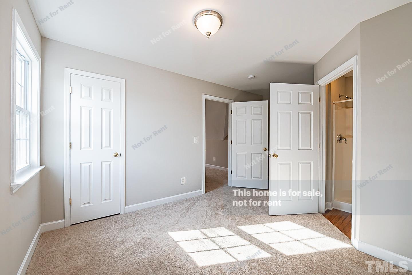 8909 Sauls Road Raleigh, NC 27603 - Photo 15 of 23 a view of a bathroom with sink and shower