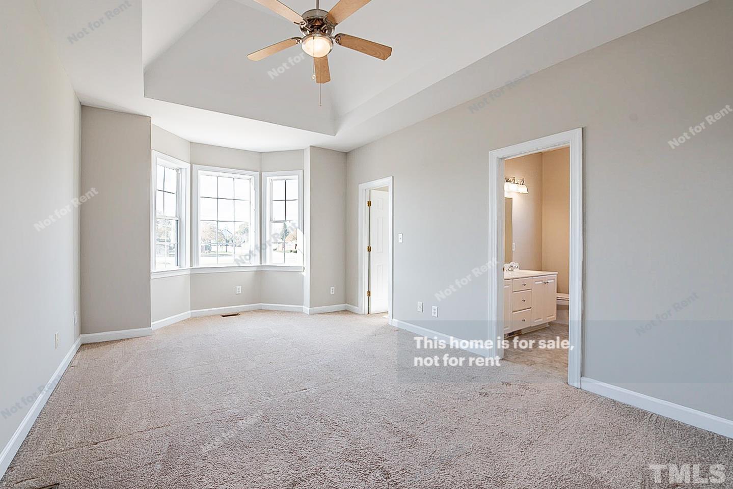 8909 Sauls Road Raleigh, NC 27603 - Photo 17 of 23 a view of an empty room with a window