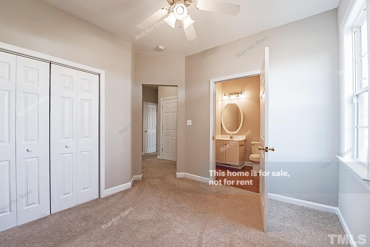 8909 Sauls Road Raleigh, NC 27603 - Photo 19 of 23 a view of a room with wooden floor mirror and windows