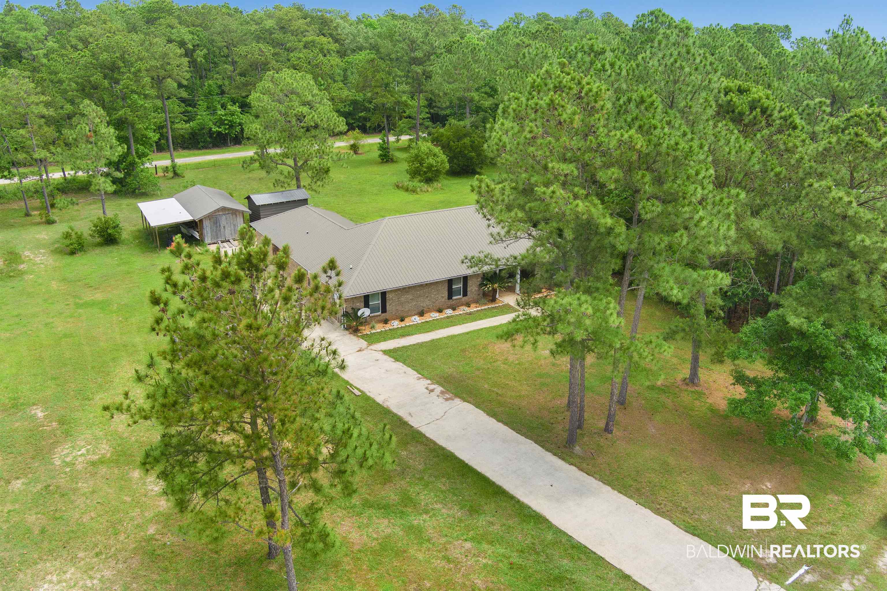 3010 Drag Strip Lane Coden, AL 36523 - Photo 43 of 44 Aerial view of property and surrounding area with a heavily wooded area