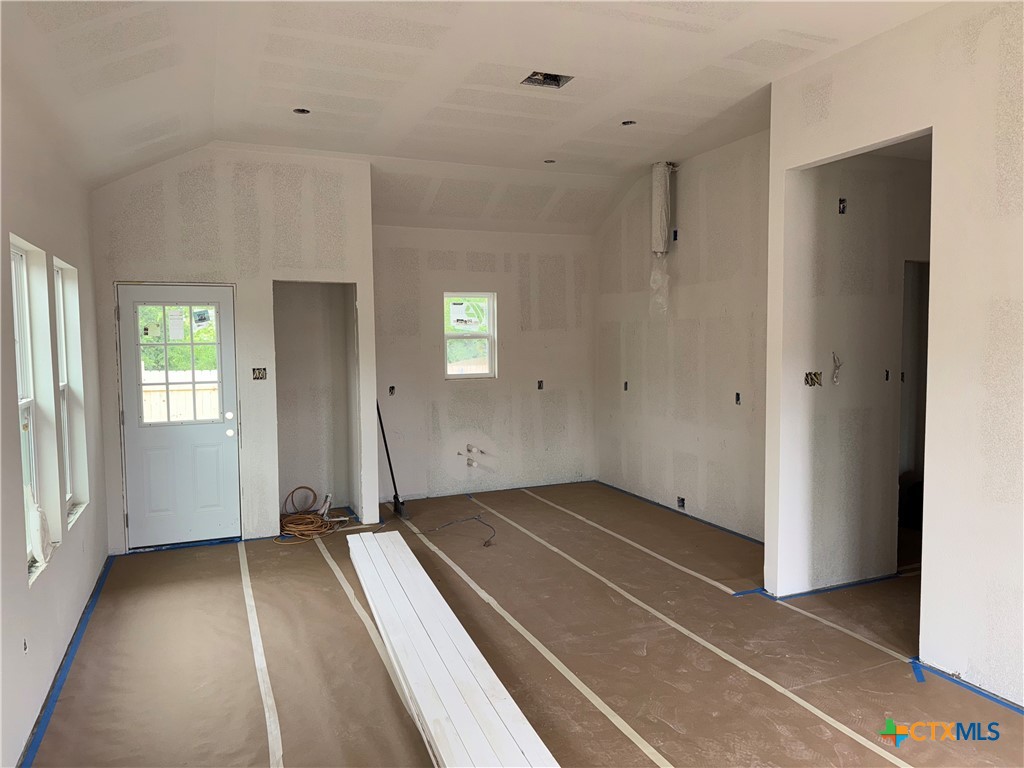 606 Bridge Street Gatesville, TX 76528 - Photo 11 of 14 a view of a room with a large window and a hallway