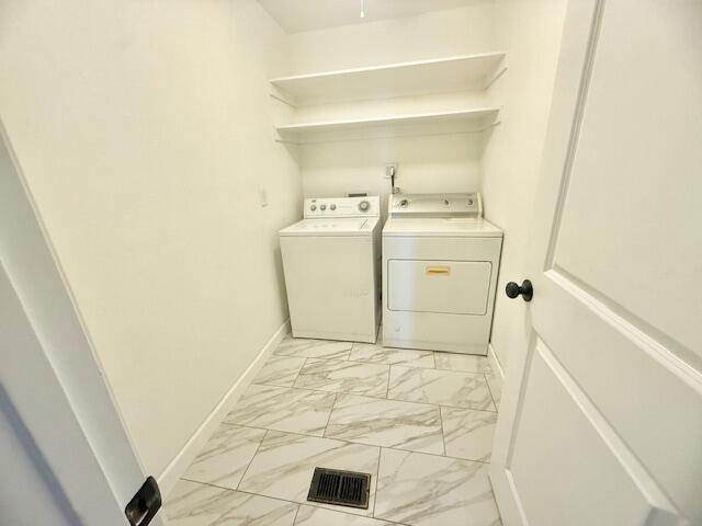 51555 Monroe Street Indio, CA 92201 - Photo 15 of 29 a utility room with a sink a washer and dryer