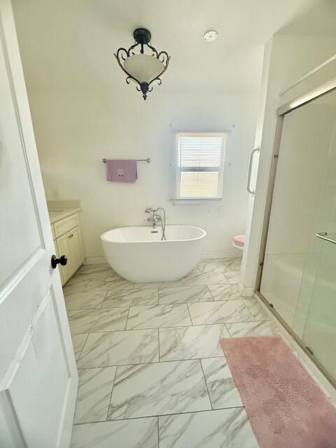 51555 Monroe Street Indio, CA 92201 - Photo 19 of 29 a bathroom with a sink a toilet and a mirror