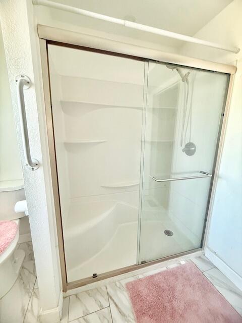 51555 Monroe Street Indio, CA 92201 - Photo 20 of 29 a bathroom with a glass door shower