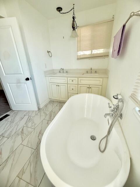 51555 Monroe Street Indio, CA 92201 - Photo 21 of 29 a bathroom with a sink and mirror