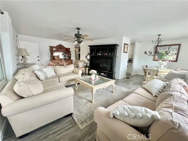 51555 Monroe Street Indio, CA 92201 - Photo 24 of 29 a living room with furniture a fireplace and a chandelier