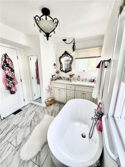 51555 Monroe Street Indio, CA 92201 - Photo 25 of 29 a bathroom with a sink mirror and window