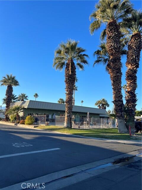 51555 Monroe Street Indio, CA 92201 - Photo 28 of 29 a view of a swimming pool with a yard and plants