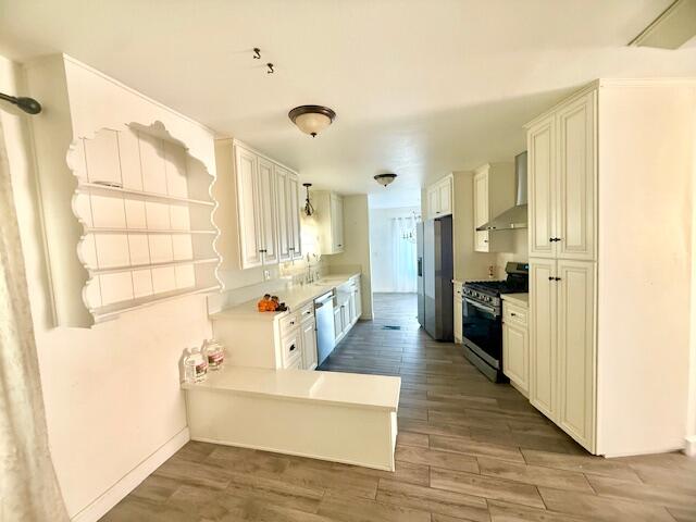 51555 Monroe Street Indio, CA 92201 - Photo 9 of 29 a large white kitchen with a refrigerator a stove top oven a sink and dishwasher