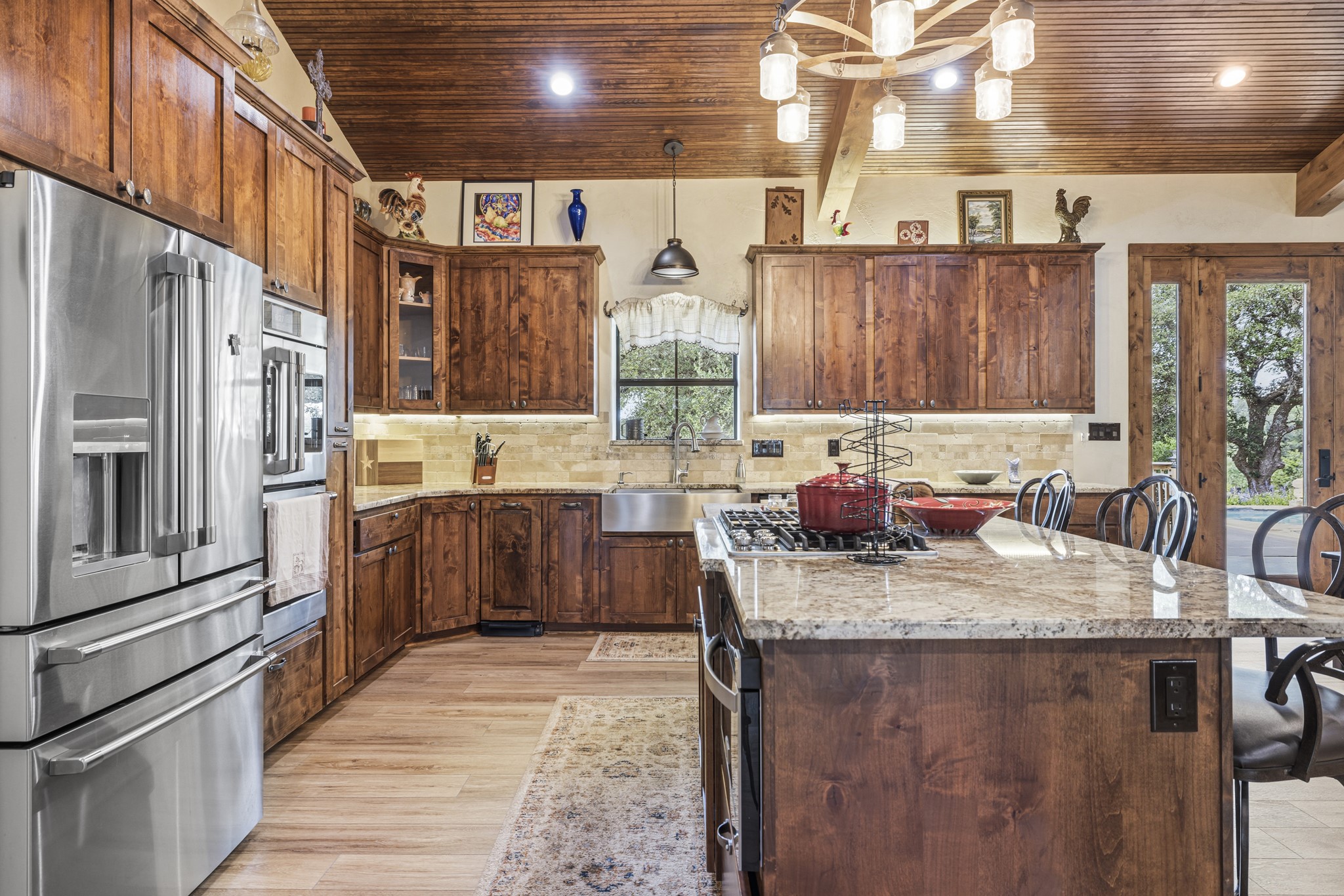 3724 Ranch Road 3347 Round Mountain, TX 78663 - Photo 6 of 40 a kitchen with stainless steel appliances granite countertop a sink stove and refrigerator