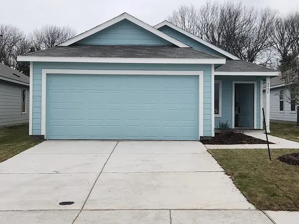 a front view of a house with garage