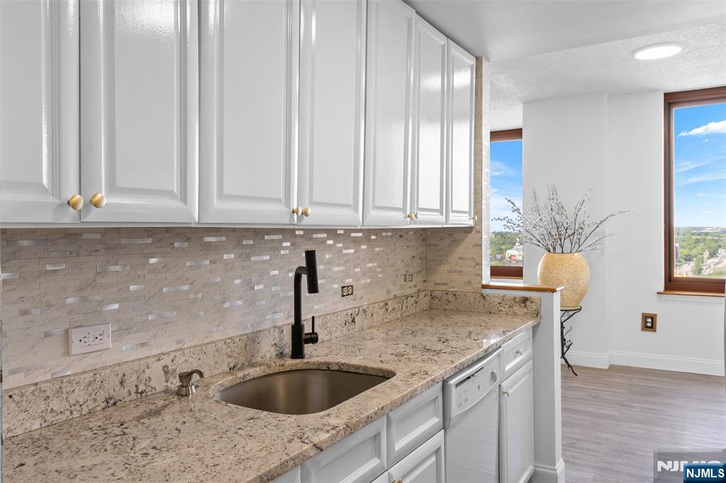 100 Old Palisade Road, Unit 3215 Fort Lee, NJ 07024 - Photo 19 of 43 a kitchen with a sink cabinets and window