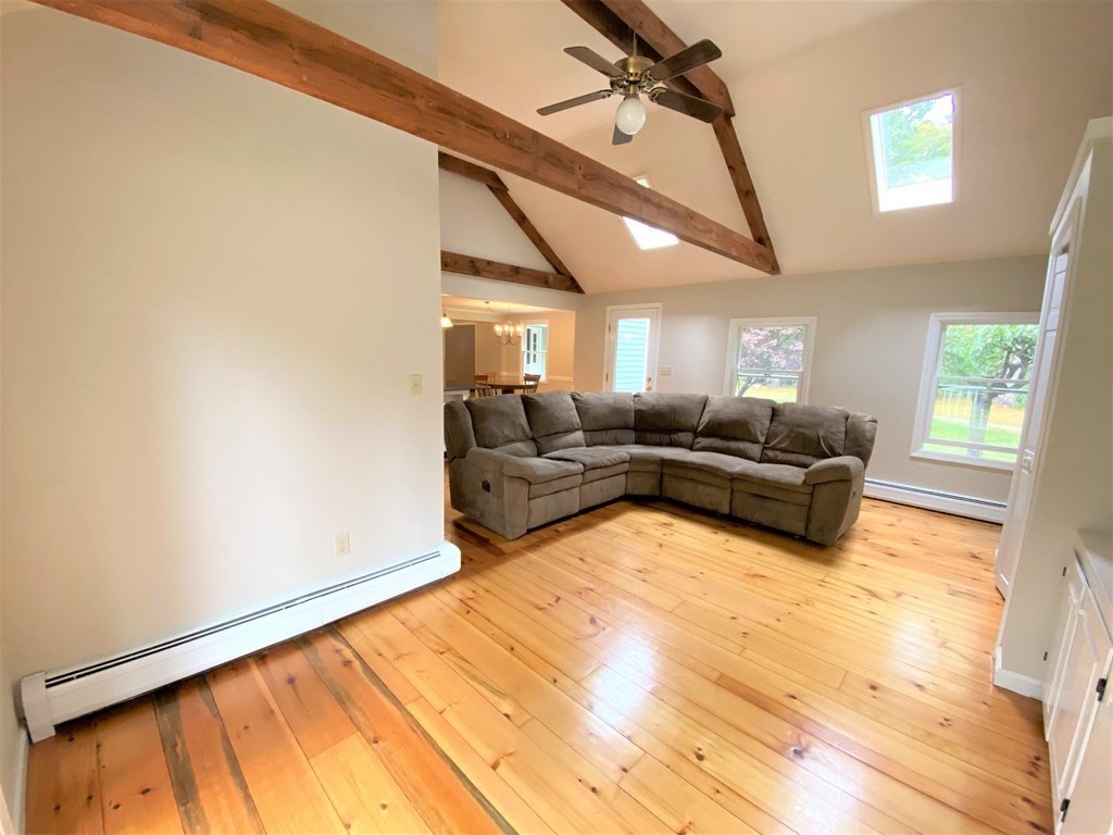 49 Mill Road Boxford, MA 01921 - Photo 4 of 40 a living room with furniture windows and a flat screen tv