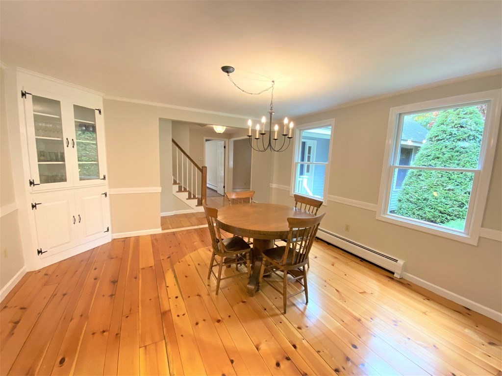 49 Mill Road Boxford, MA 01921 - Photo 5 of 40 a view of a dining room with furniture and wooden floor