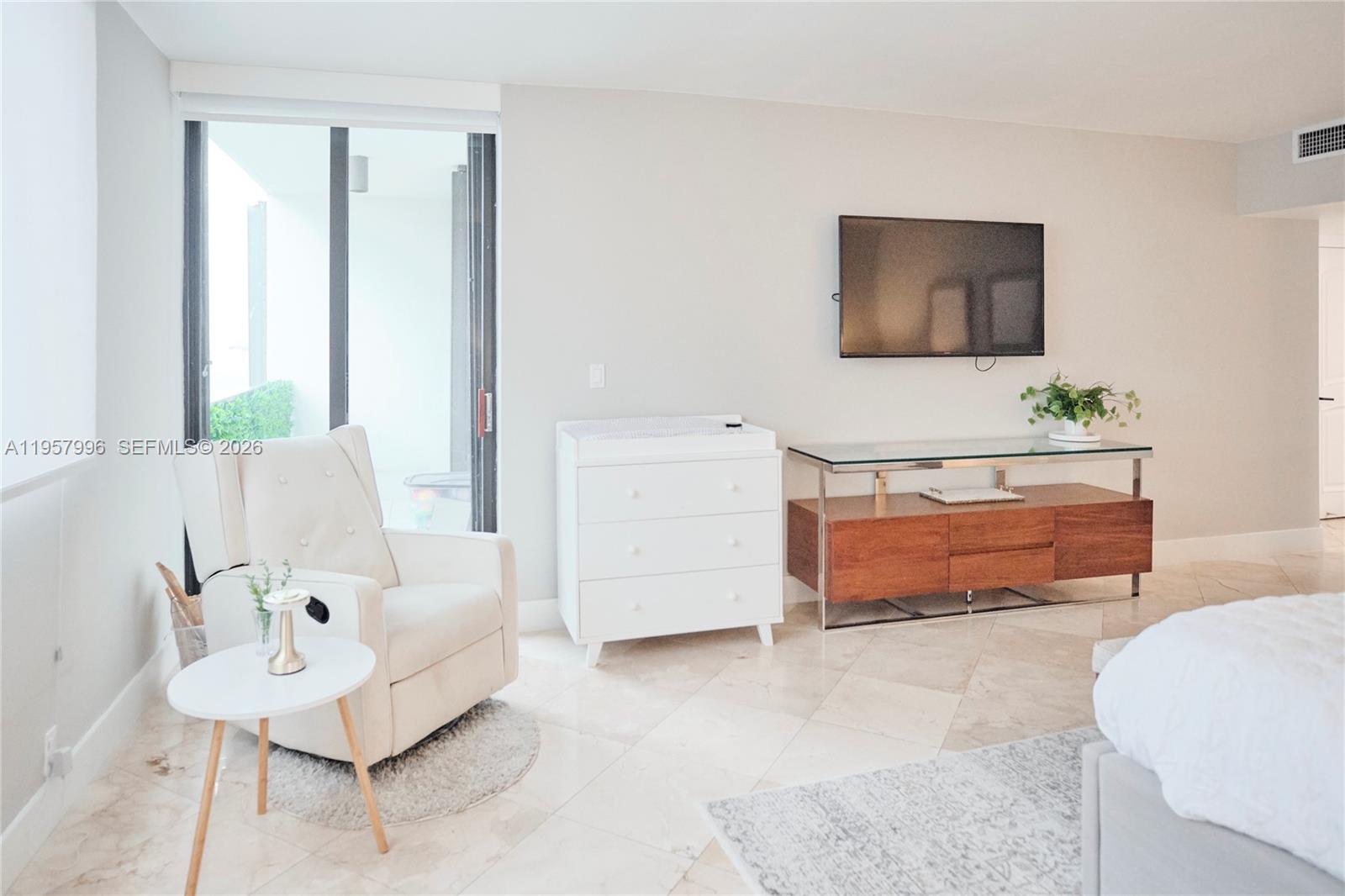 520 Brickell Key Drive, Unit A1904 Miami, FL 33131 - Photo 8 of 27 a living room with furniture and a couch