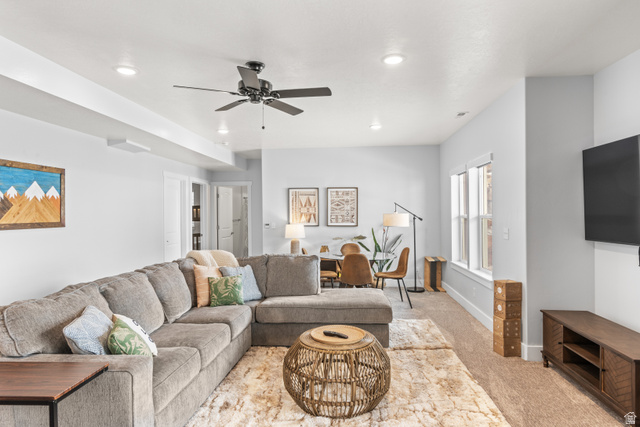 1343 North Trapper Loop Garden City, UT 84028 - Photo 29 of 56 Living area featuring ceiling fan, light colored carpet, and recessed lighting