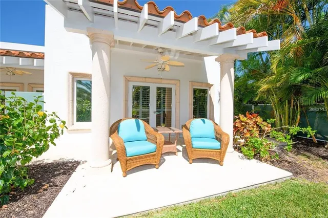 a view of a dining room with furniture a chandelier and wooden floor