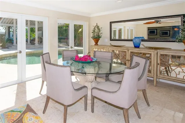 a dining room with furniture and window
