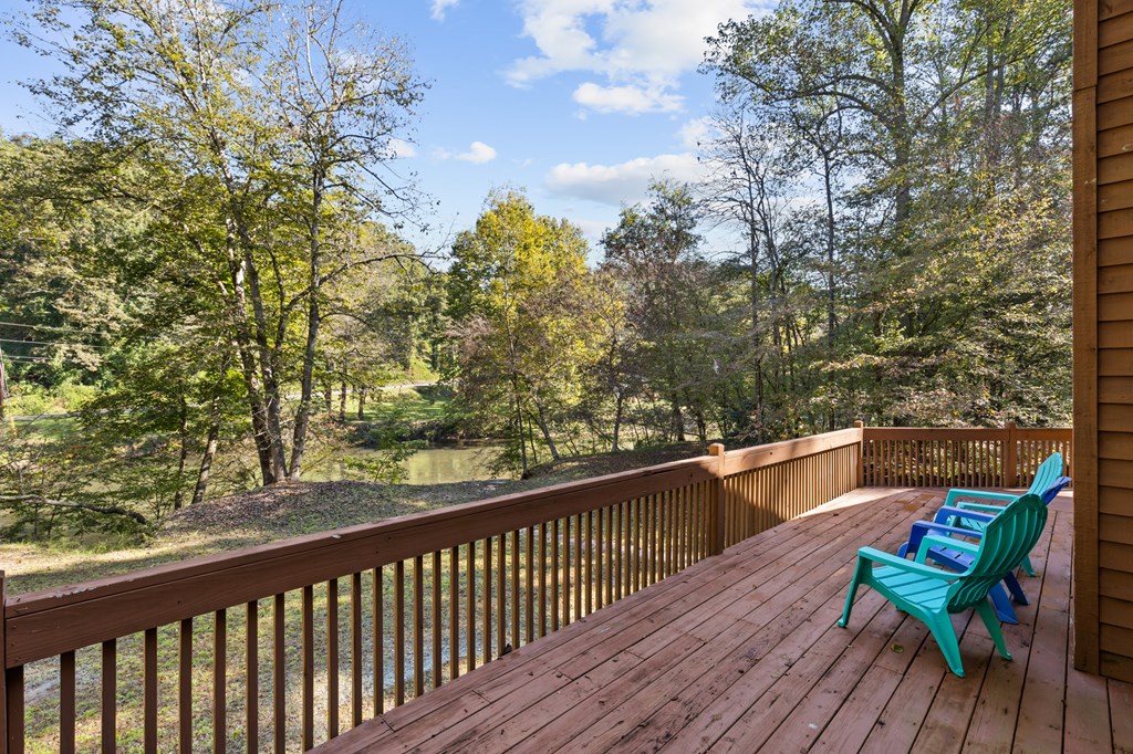 96 Holiday Court Ellijay, GA 30540 - Photo 7 of 51 a view of a balcony with wooden floor and bench
