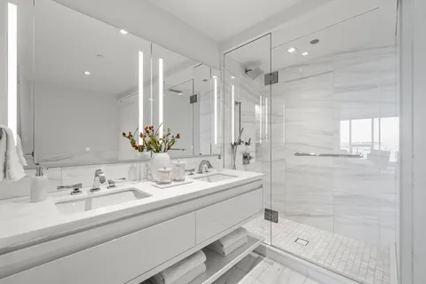 a white bath tub sitting in a bathroom