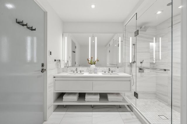 a bed room with a bed and a painting on the wall