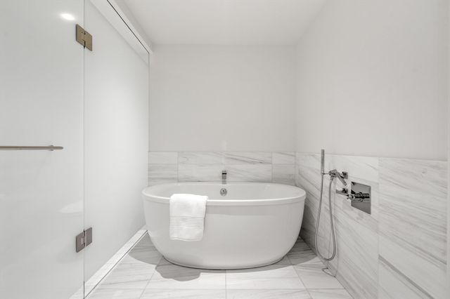 a bathroom with a double vanity sink mirror and shower