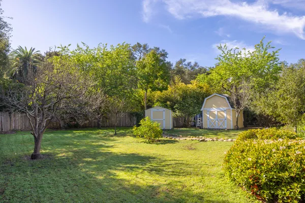 a view of a swimming pool with a yard