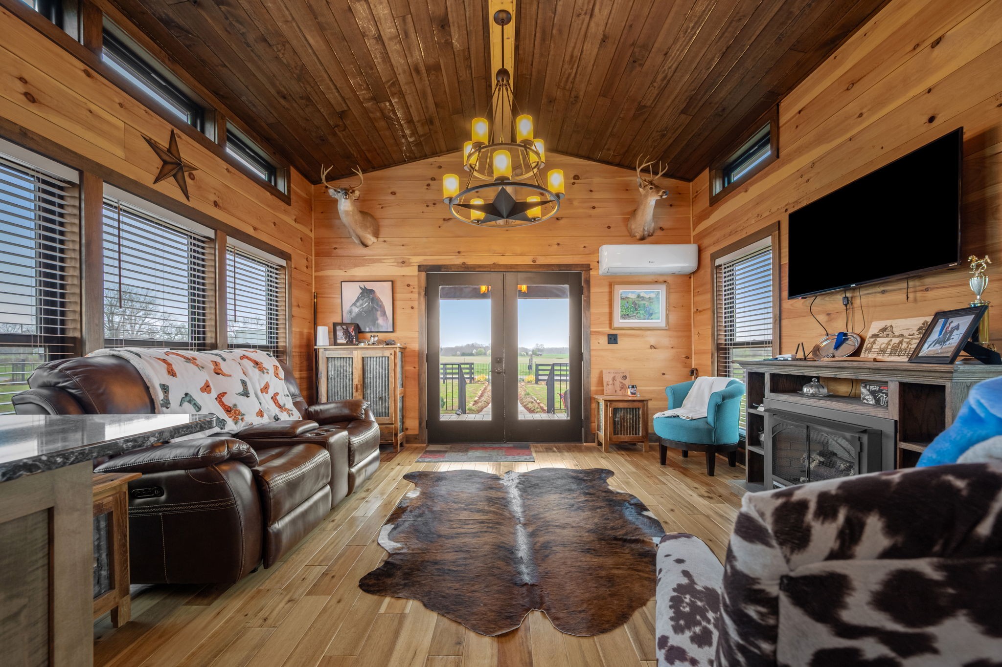 1765 Sugartree Springs Road Belvidere, TN 37306 - Photo 27 of 42 a living room with furniture a flat screen tv and kitchen view