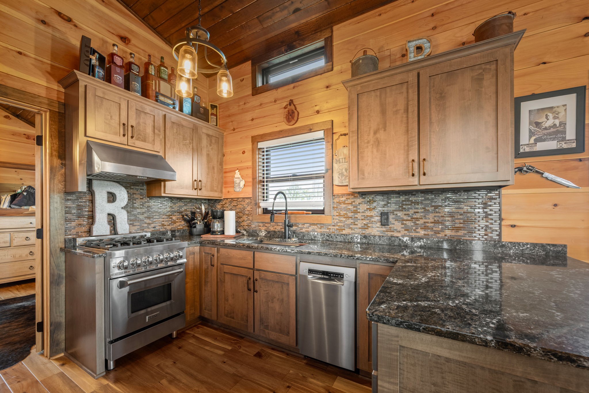 1765 Sugartree Springs Road Belvidere, TN 37306 - Photo 32 of 42 a kitchen with stainless steel appliances granite countertop a stove a sink and a refrigerator