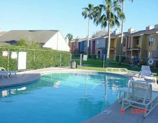 6702 Everhart Road, Unit S101 Corpus Christi, TX 78413 - Photo 4 of 4 a view of backyard with swimming pool and outdoor seating