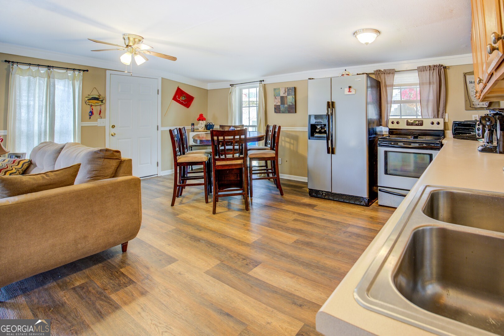 141 Andrea Circle Jackson, GA 30233 - Photo 13 of 41 a living room with stainless steel appliances furniture or kitchen view and a refrigerator