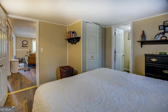 a bedroom with a bed and a view of bathroom