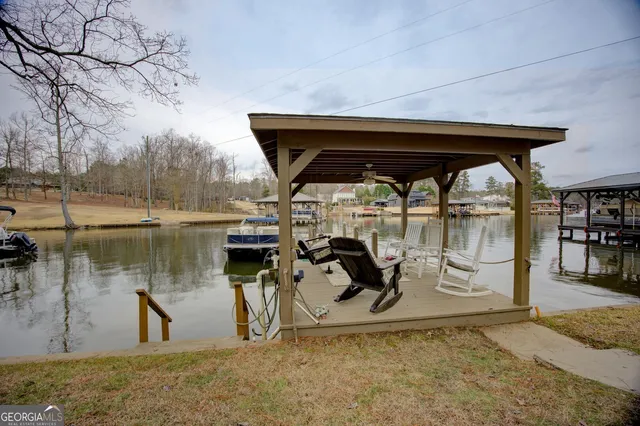 a view of a lake with outdoor seating