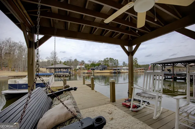 a lake view with tables and chairs
