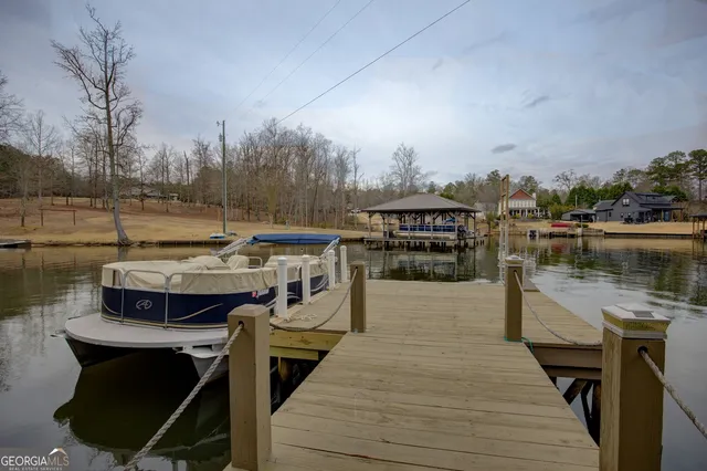 a view of a house with a yard and garage