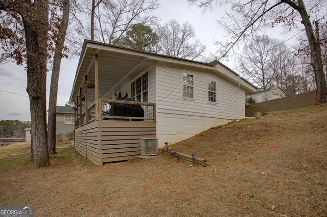a view of a lake with outdoor seating