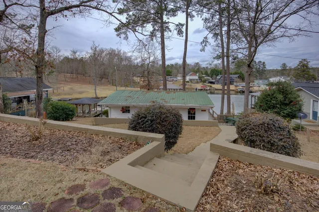 a view of a water fountain and a bench