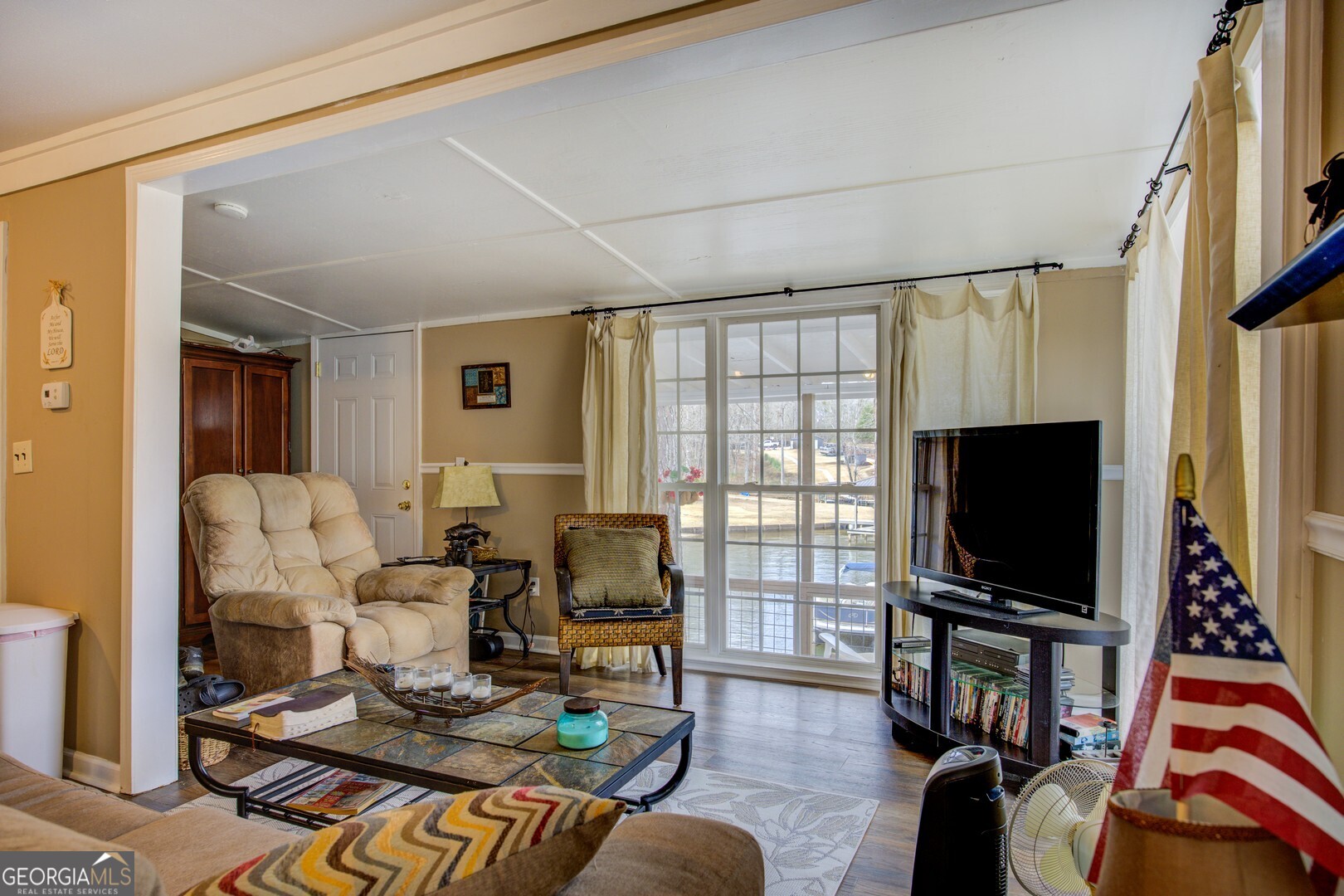 141 Andrea Circle Jackson, GA 30233 - Photo 5 of 41 a living room with furniture and a flat screen tv