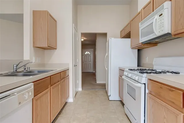 a kitchen with stainless steel appliances granite countertop a stove and a sink
