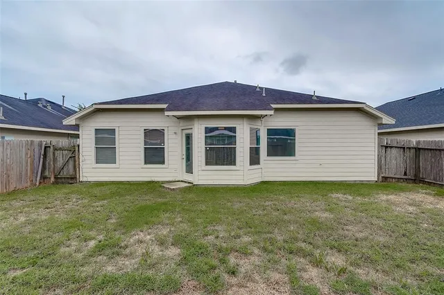 a house that has a big yard in front of it