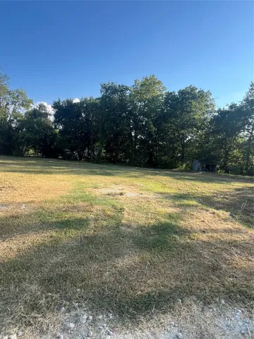 a view of a large swimming pool and an outdoor space