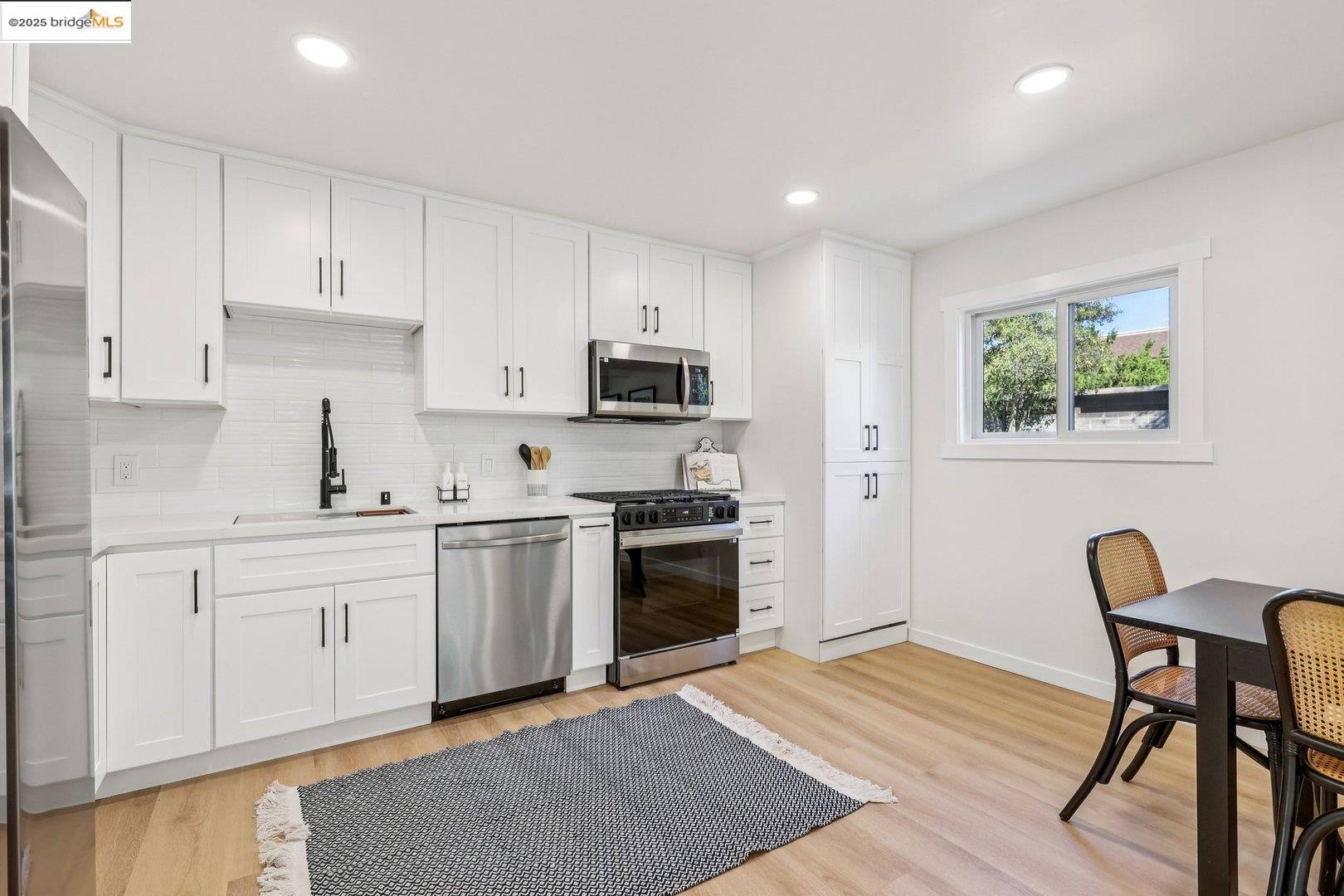 4185 Huckleberry Drive Concord, CA 94521 - Photo 13 of 33 a kitchen with a stove top oven sink and cabinets