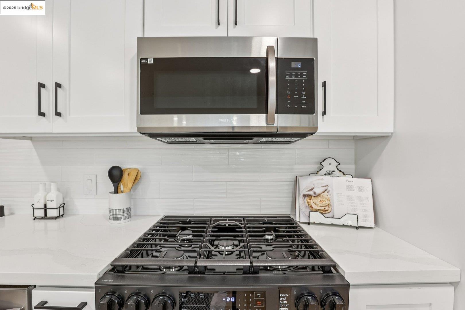 4185 Huckleberry Drive Concord, CA 94521 - Photo 16 of 33 a kitchen with a stove and a microwave