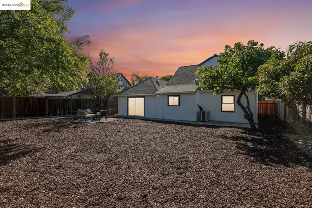 a backyard of a house with lots of green space