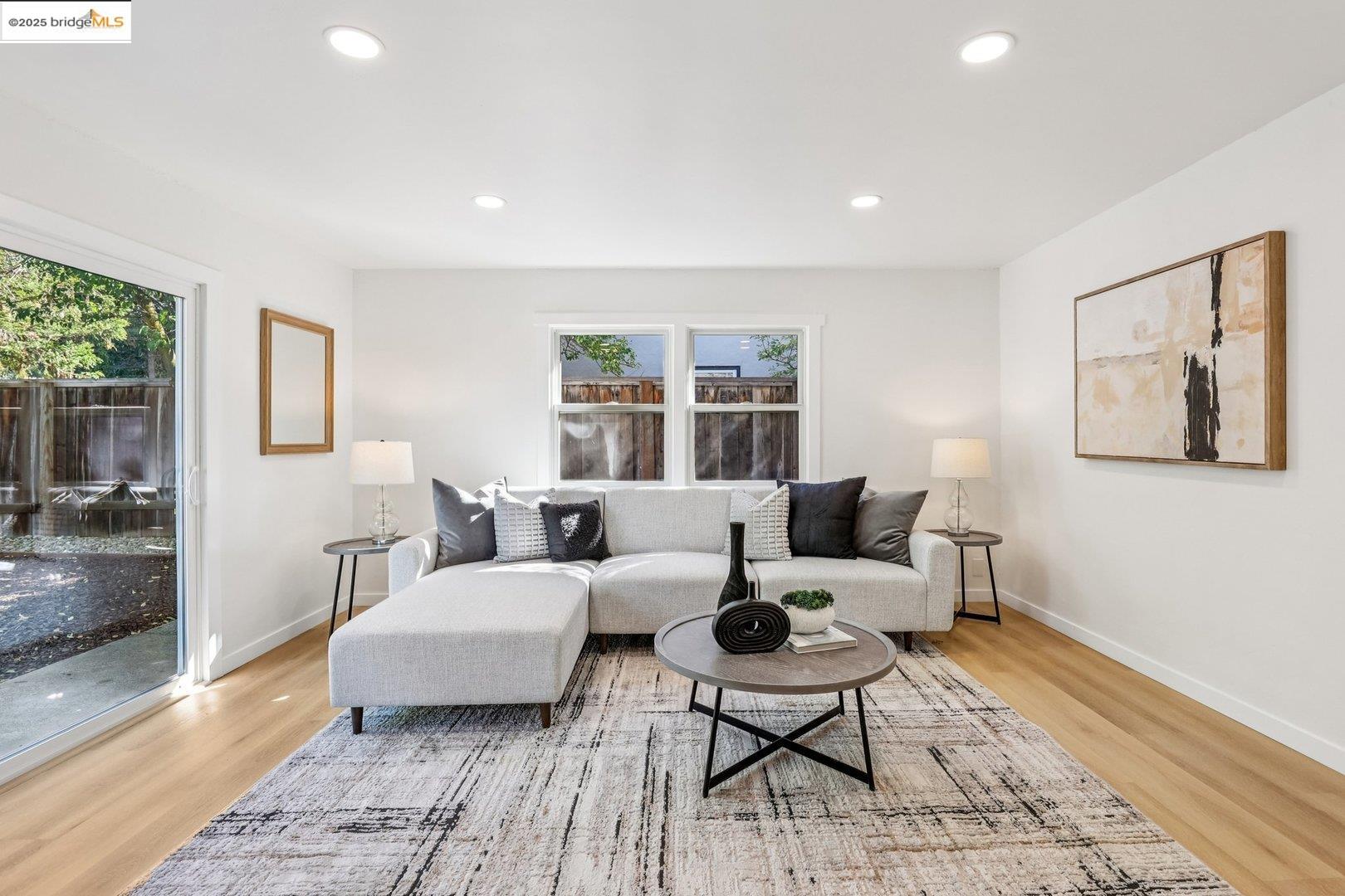 4185 Huckleberry Drive Concord, CA 94521 - Photo 8 of 33 a living room with furniture wooden floor and a rug