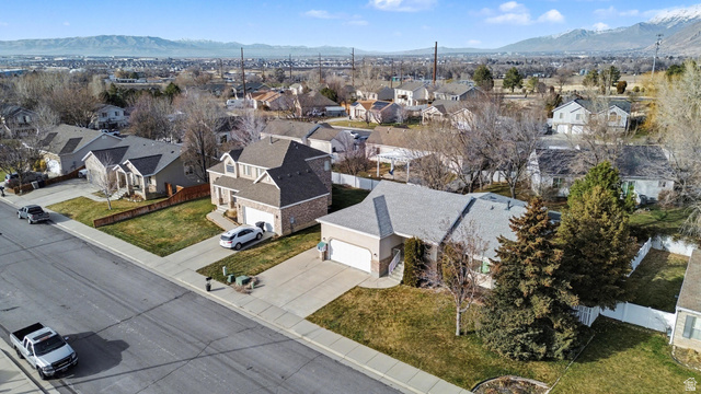 281 Winchester Drive Springville, UT 84663 - Photo 21 of 27 Aerial view of residential area featuring a mountainous background