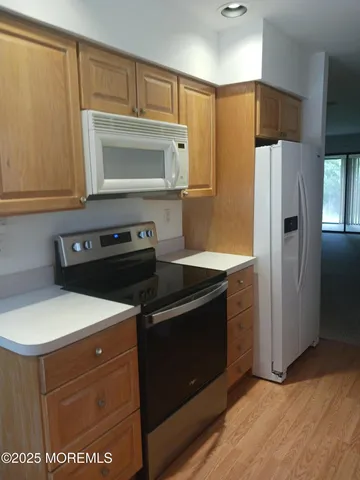 a kitchen with a stove microwave and refrigerator