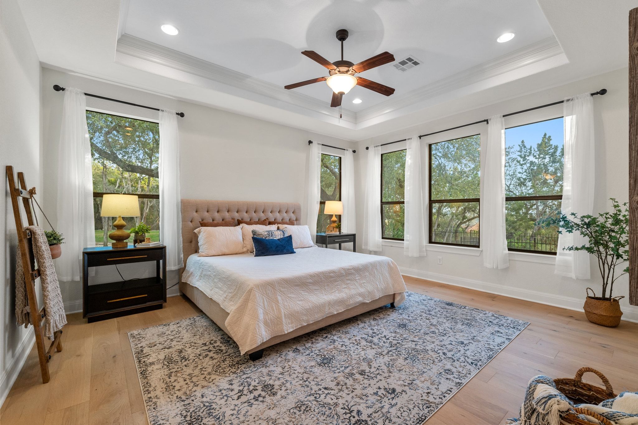 3701 Copper Ridge Court Austin, TX 78734 - Photo 13 of 30 a spacious bedroom with a large bed and a chandelier