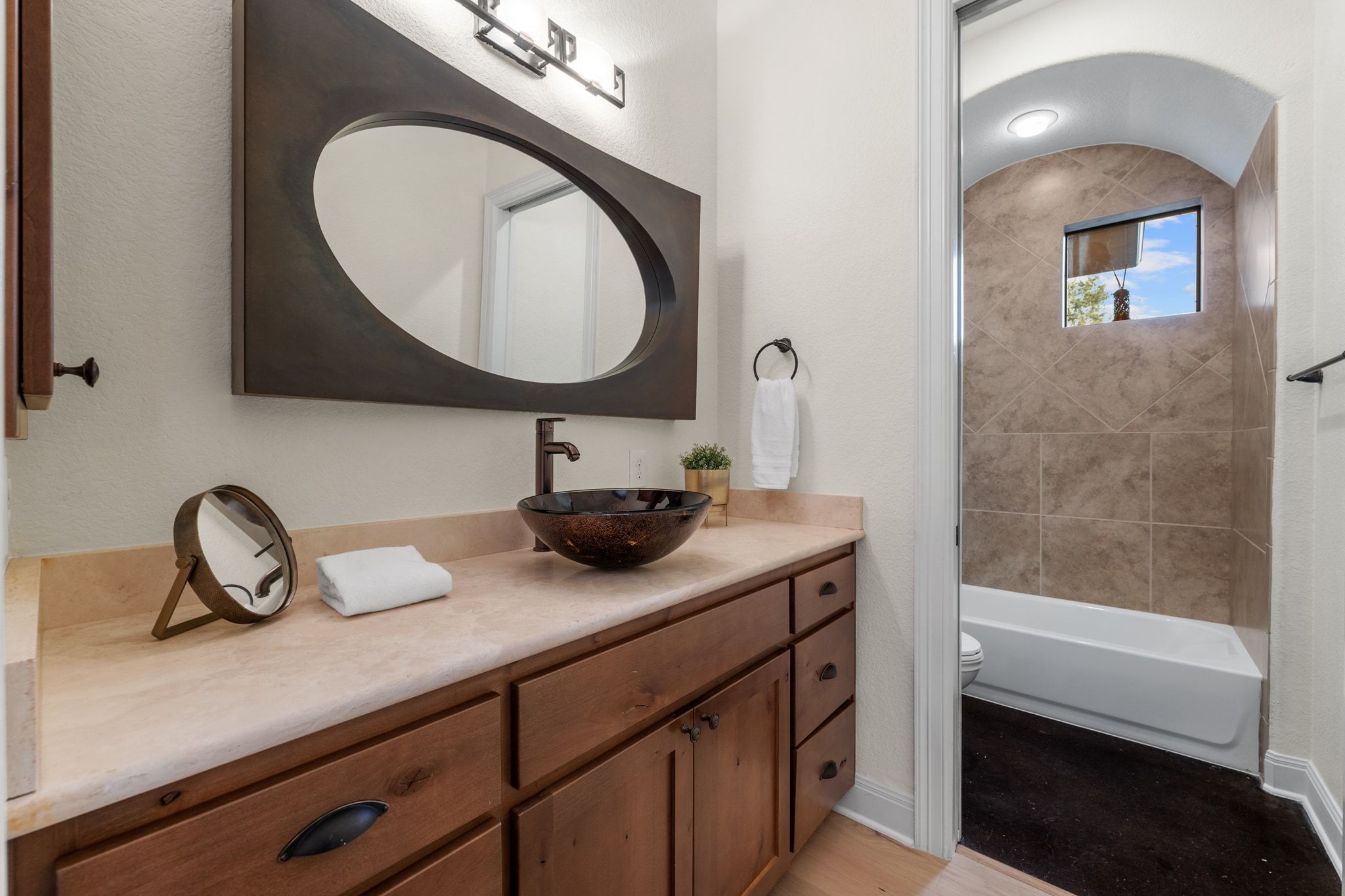 3701 Copper Ridge Court Austin, TX 78734 - Photo 18 of 30 a bathroom with a toilet a sink and mirror