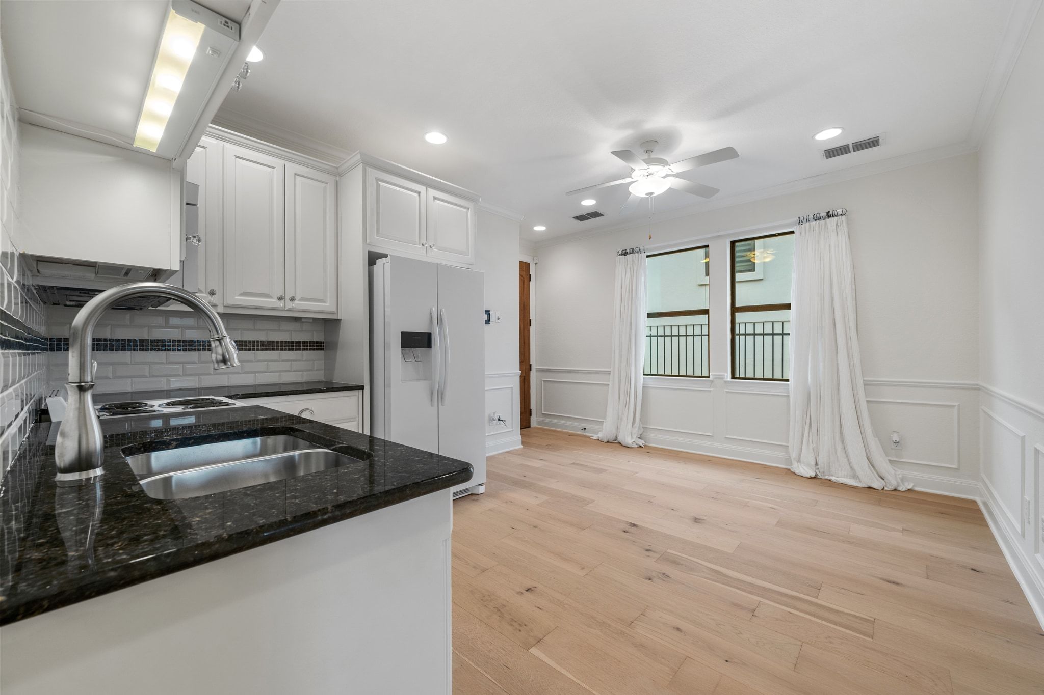 3701 Copper Ridge Court Austin, TX 78734 - Photo 21 of 30 a kitchen with granite countertop a sink stainless steel appliances and cabinets